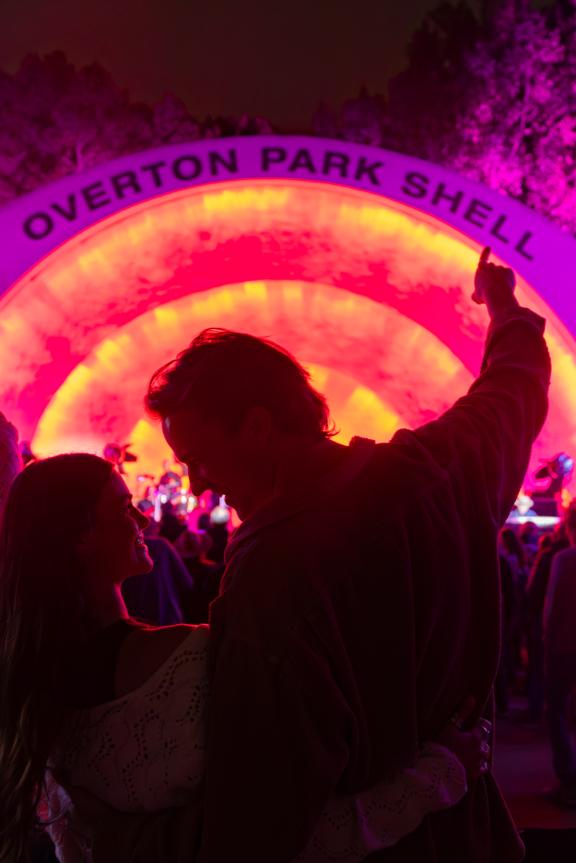 A couple stands together in front of Memphis' Overton Park Shell during a concert
