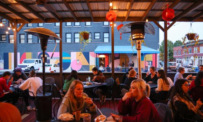 People dining on Good Fortune's patio.
