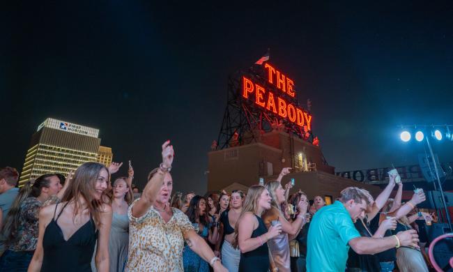 people dancing during Peabody rooftop party