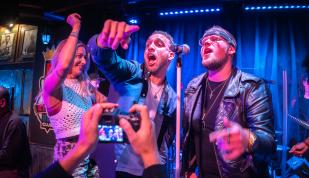 Friends dancing and singing on stage at B.B. King's Blues Club in Memphis, Tennessee