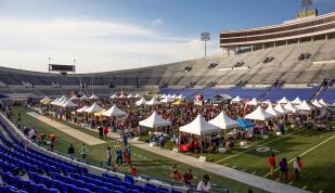 Dozens of pop-up tents set up on the field inside Simmons Bank Stadium for Chicken and Beer Festival.