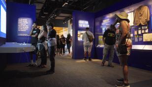 people inside National Civil Rights Museum new Legacy Experience looking at exhibits
