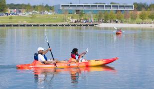 A couple kayaking at Shelby Farms in Memphis.