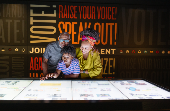 A family explores an interactive exhibit at Memphis' National Civil Rights Museum.