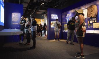 people inside National Civil Rights Museum new Legacy Experience looking at exhibits